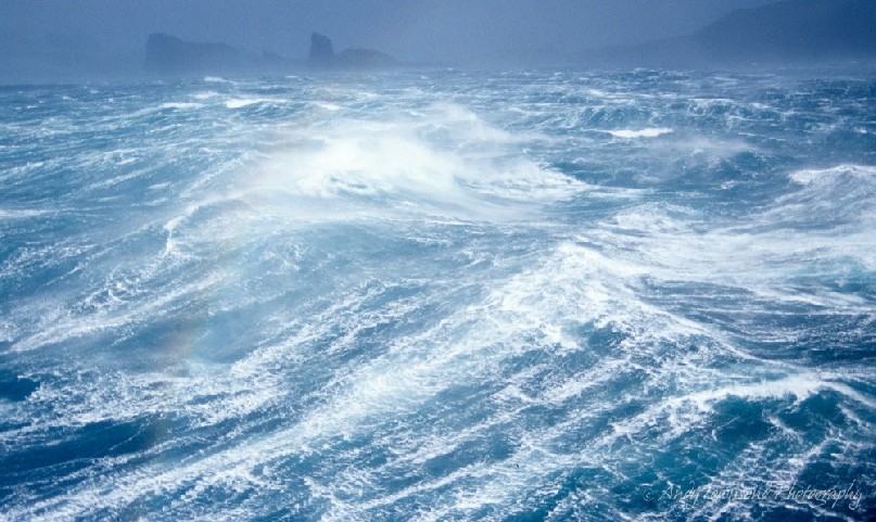 Gale force winds lash the coastline off the coast of Heard island.