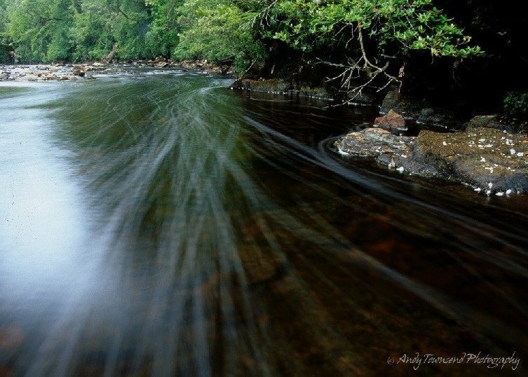 A long exposure shows water bubbles streaming towards the foreground in the upper reaches of the Donaldson River.