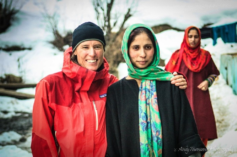 Two woman, a skier and local, enjoy a hug and portrait in Drung village.