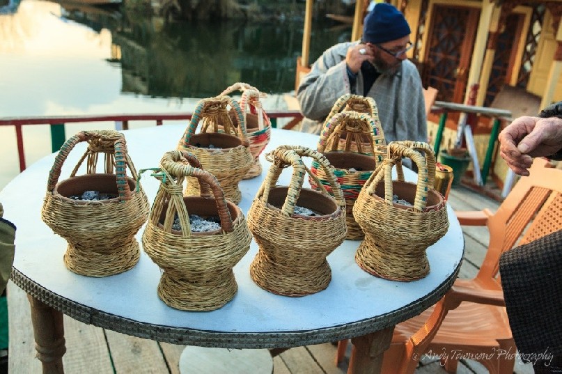 Kangri pots filled with hot embers ready to put under Phirans for an evening trip on Dal Lake.